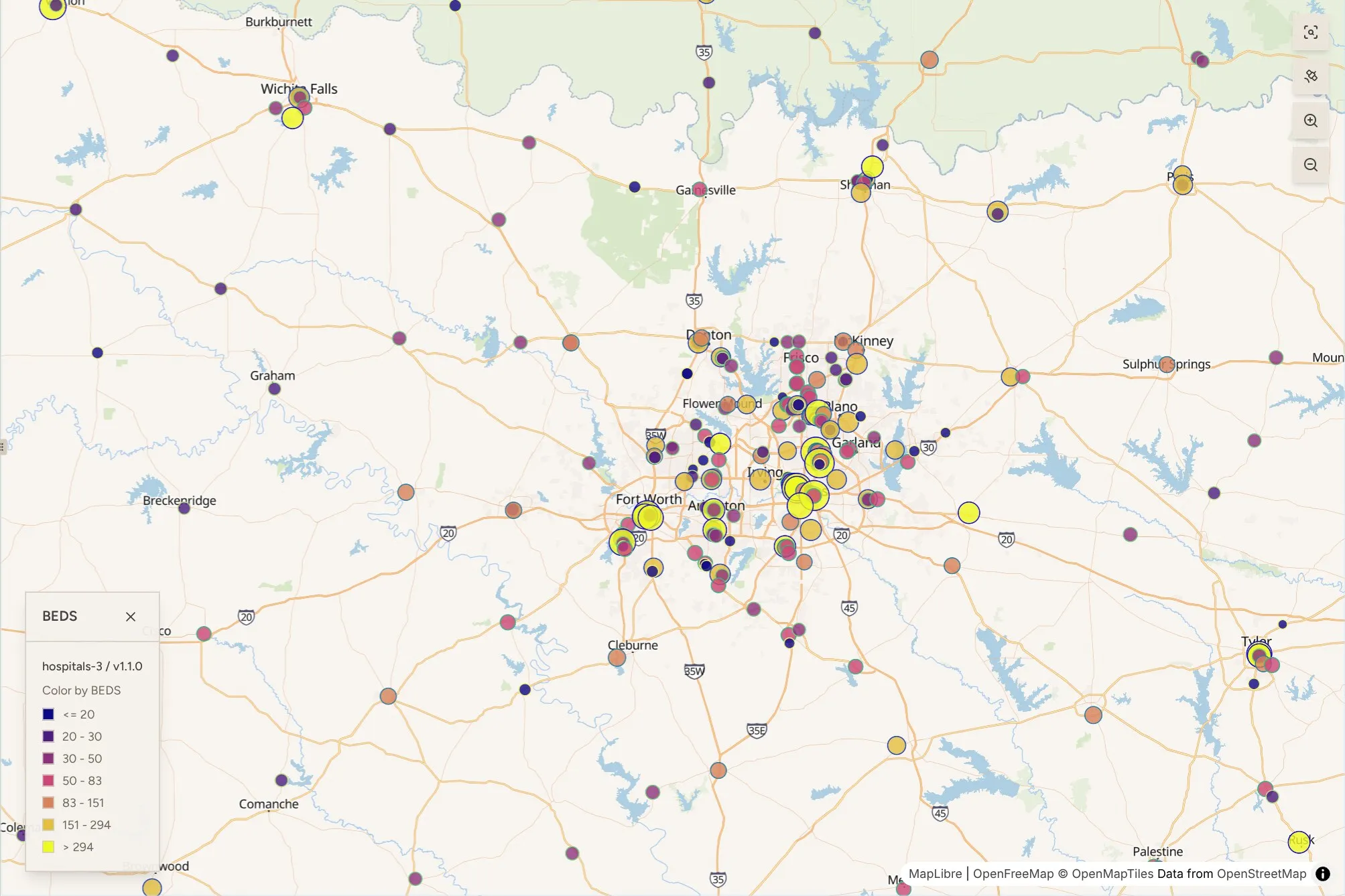 HIFLD Next map of hospitals around Dallas–Fort Worth from version 1.1.0 of the hospital layer, with each hospital drawn as a circle sized and colored by bed count. The largest hospitals, over 294 beds, cluster in yellow between Fort Worth, Dallas and Plano.